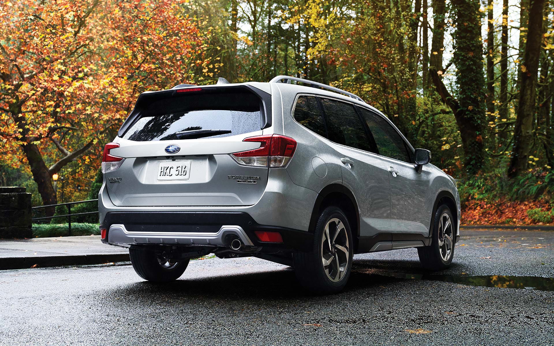 The rear of the 2022 Forester on a neighborhood street. | Open Road Subaru in Union NJ