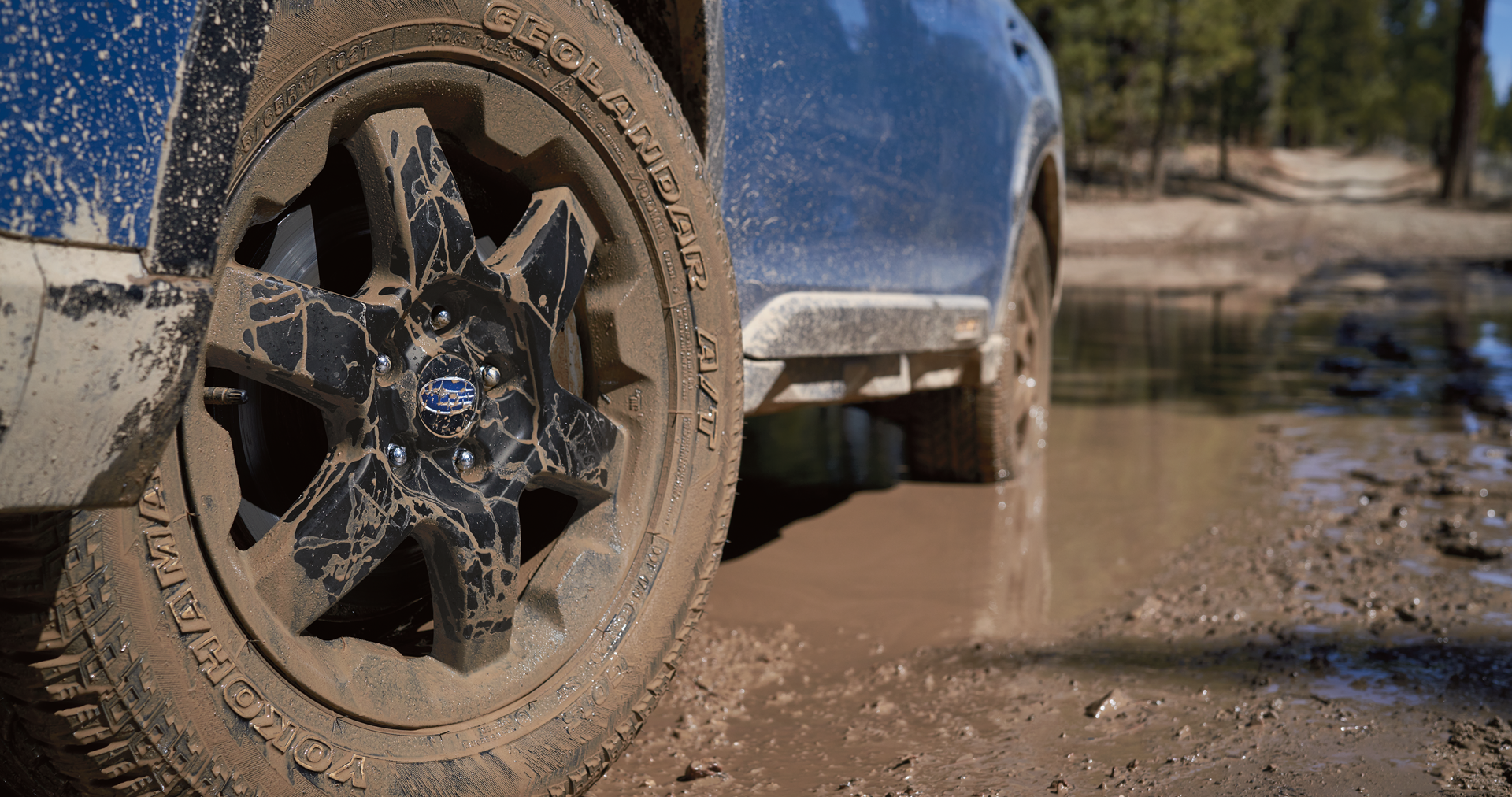 A close-up of the 17-inch off-road wheels and all-terrain Yokohama GEOLANDAR® tires on the 2023 Outback Wilderness. | Open Road Subaru in Union NJ
